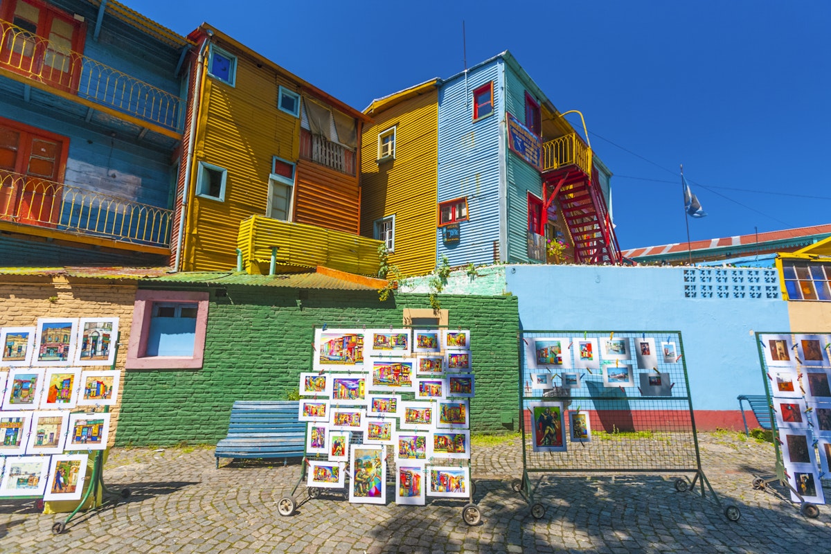 Colorful buildings and tourist souvenirs in the small street of Caminito, La Boca, Buenos Aires, Argentina.