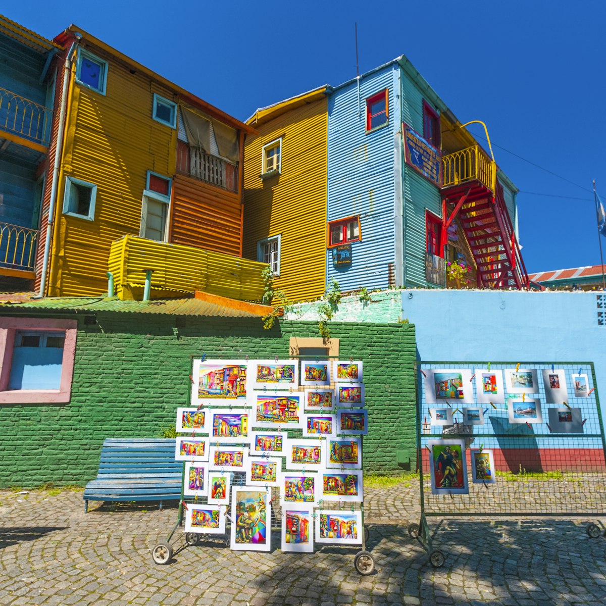 Colorful buildings and tourist souvenirs in the small street of Caminito, La Boca, Buenos Aires, Argentina.