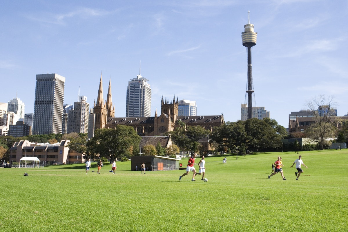 People playing soccer on the Domain.