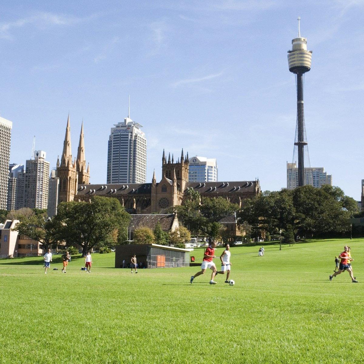 People playing soccer on the Domain.