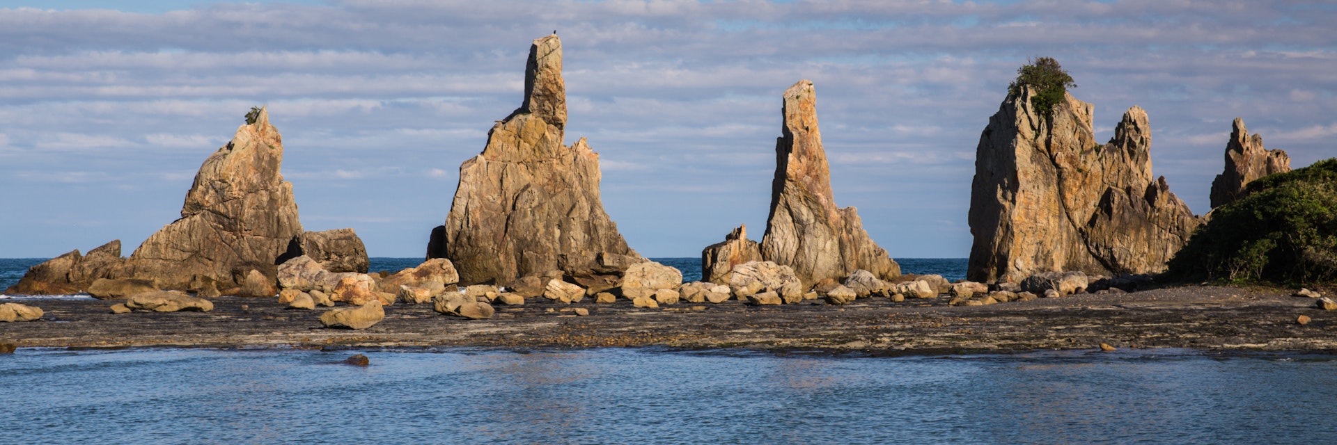A natural formation of Hashigui Iwa rock, Kushimoto town, Wakayama, Japan; Shutterstock ID 635896211; Your name (First / Last): Laura Crawford; GL account no.: 65050; Netsuite department name: Online Editorial; Full Product or Project name including edition: Kii Peninsula page online images for BiT