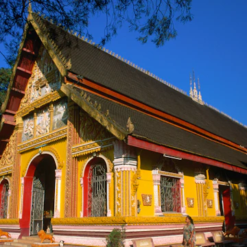 A monk enters the Wat Si Muang in Vientiane. The spot for this monastery was chosen in 1563