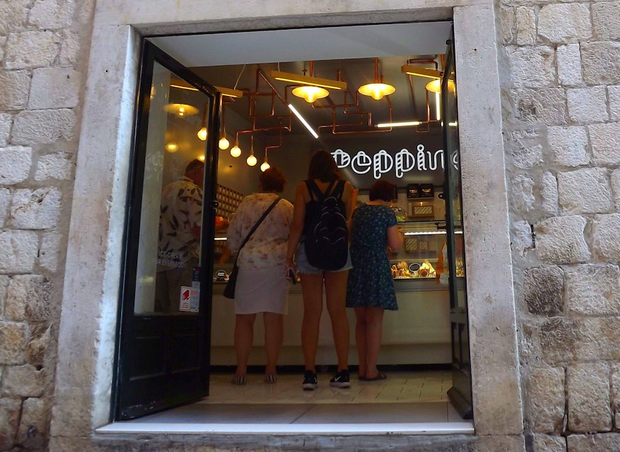 The front entrance to Peppino's is at the shopping street of Prijeko