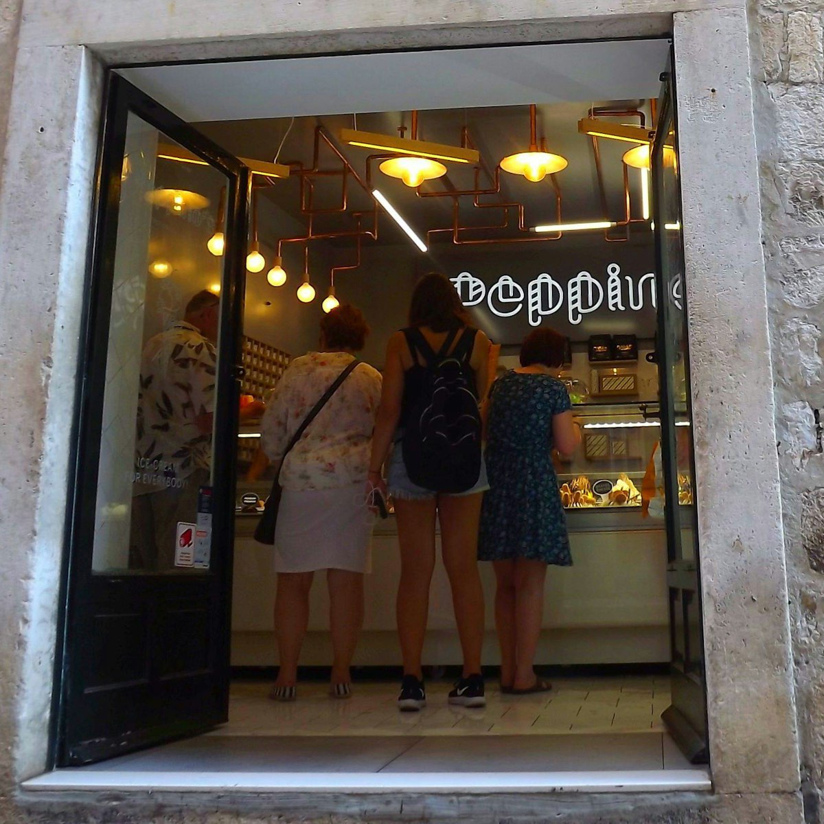 The front entrance to Peppino's is at the shopping street of Prijeko