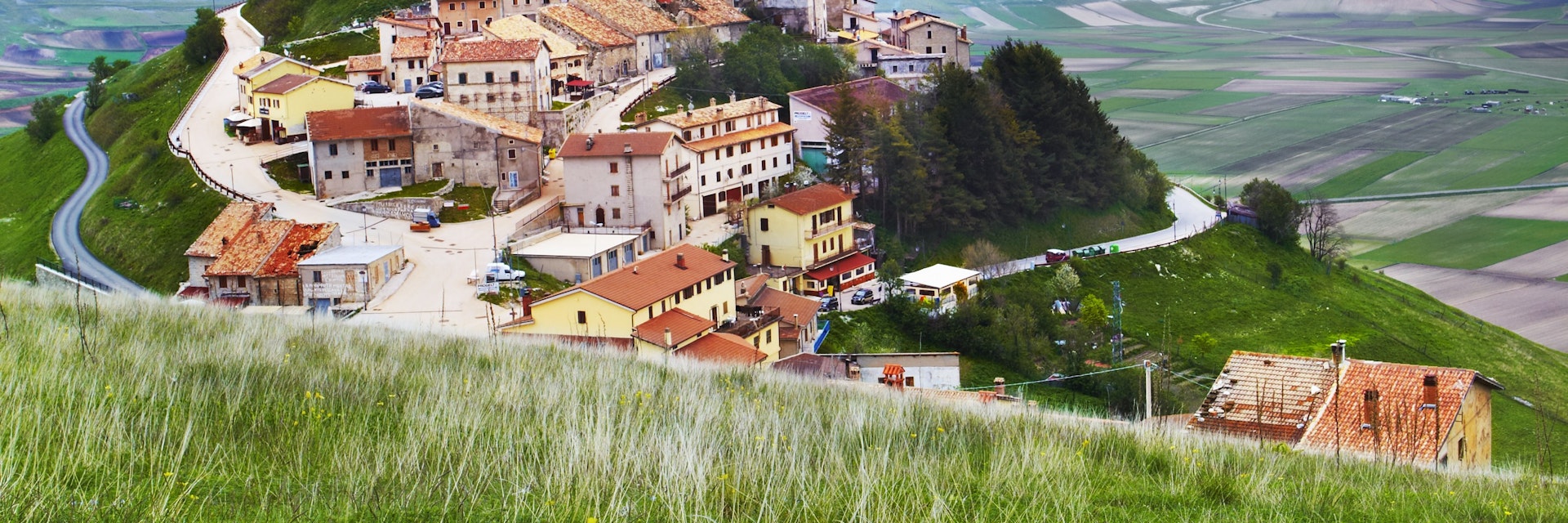 Monti Sibillini towering above hilltop village of Castelluccio.