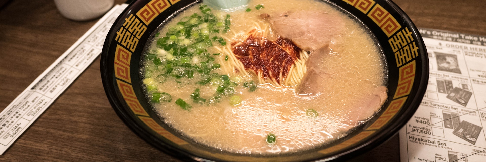 Fukuoka, Japan - Jan 20, 2017 : Ichiran Ramen chain in Fukuoka at Hakata railway station. Ichiran Tonkotsu Ramen is found in Fukuoka Prefecture in 1960.; Shutterstock ID 584799376; Your name (First / Last): Laura Crawford; GL account no.: 65050; Netsuite department name: Online Editorial; Full Product or Project name including edition: POI images for lp.com