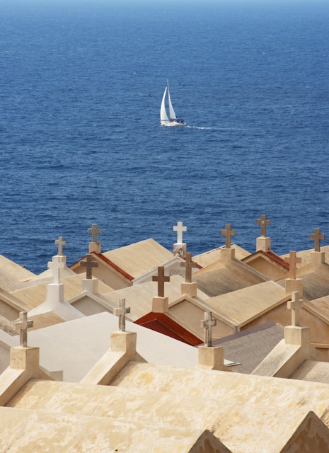 Crosses on rooftops of houses in southern Corsica.