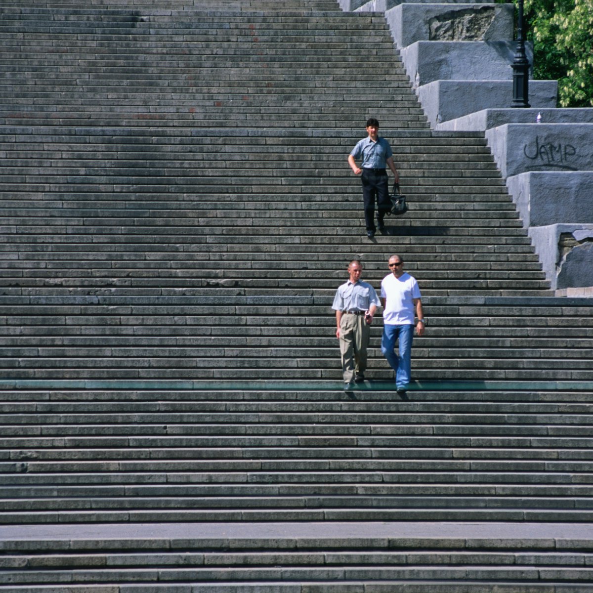 Three men walking down Potemkin Steps.