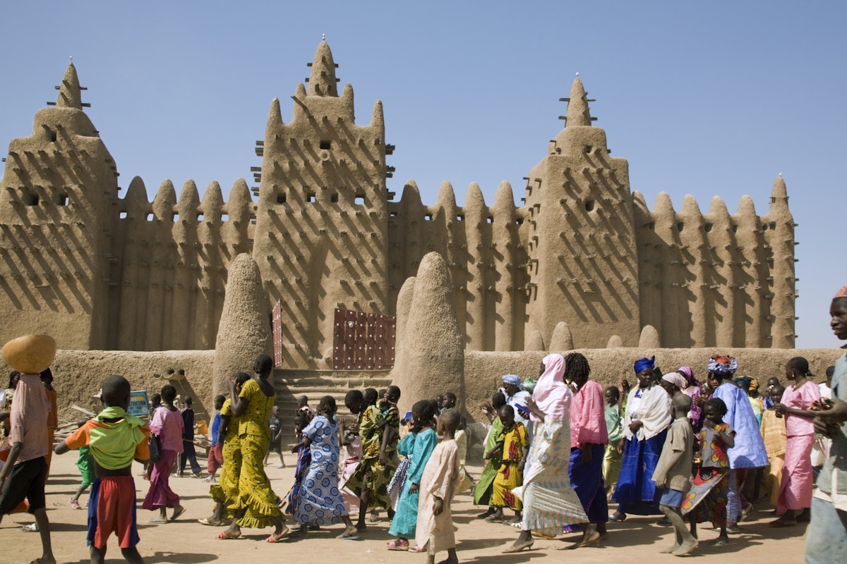 Mali, Djenne. The Great Mosque of Djenne - constructed in 1907 on the foundations of a 13th century mosque built by King Koy Konboro, the 26th ruler of Djenne. This very beautiful mosque is the largest mud structure in the world. The residents of the town