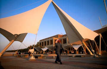 Kuwaiti walking in front of Scientific Centre.