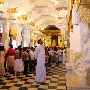 KANDY/SRI LANKA - FEB 06: Crowds of people pay respect to the Buddhist relic on February 06, 2013 in Temple of the Buddha Tooth, Kandy, Sri Lanka. ; Shutterstock ID 147514913; Your name (First / Last): Josh Vogel; GL account no.: 56530; Netsuite department name: Online Design; Full Product or Project name including edition: Digital Content/Sights