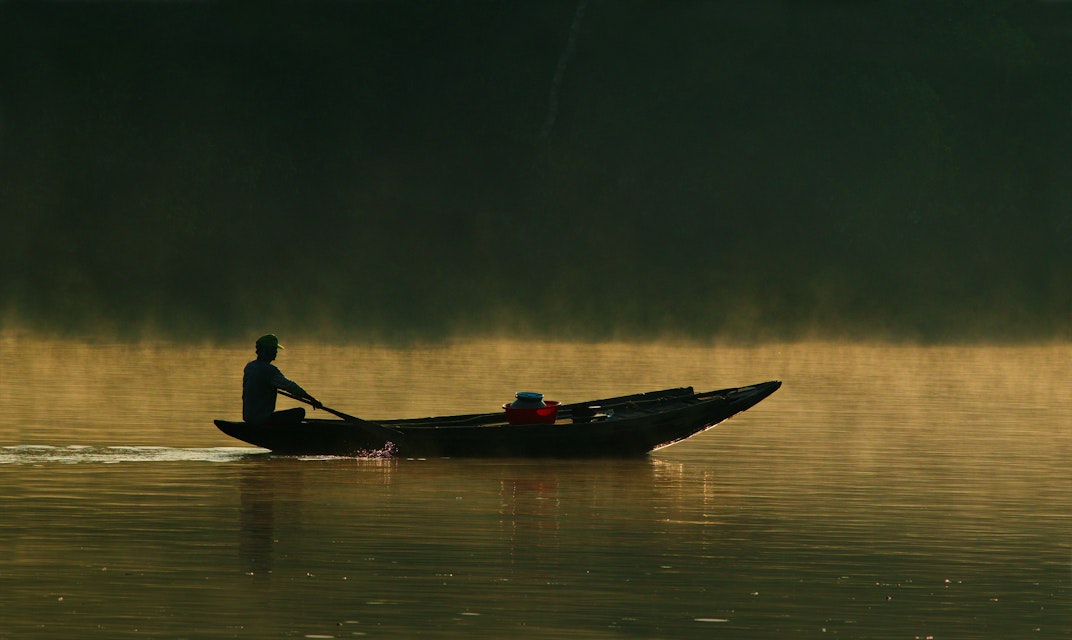 Boatman flying at Majestic Light of Sundarbans.