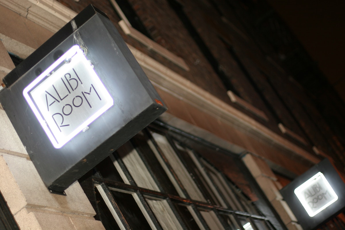 Alibi Room sign, lit at night, Gastown.