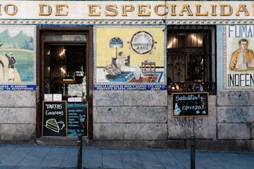 Madrid, Spain - July 9, 2017: Typical bar in Malasa a district in Madrid. Malasa a is one of the trendiest neighborhoods in Madrid, well known for its counter-cultural scene.; Shutterstock ID 1031467828