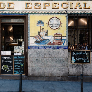 Madrid, Spain - July 9, 2017: Typical bar in Malasa a district in Madrid. Malasa a is one of the trendiest neighborhoods in Madrid, well known for its counter-cultural scene.; Shutterstock ID 1031467828