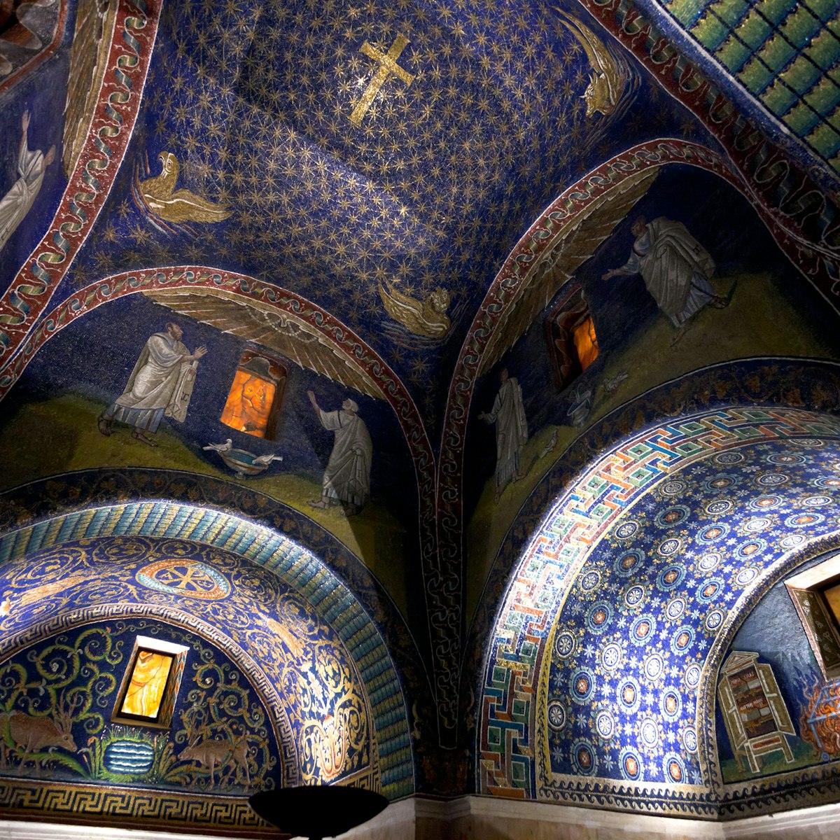 dark blue Ceiling Mosaic of the galla placidia mausoleum. Built between 425 and 433, this small mausoleum adopts a cruciform plan, in Ravenna, Italy on November 4, 2012