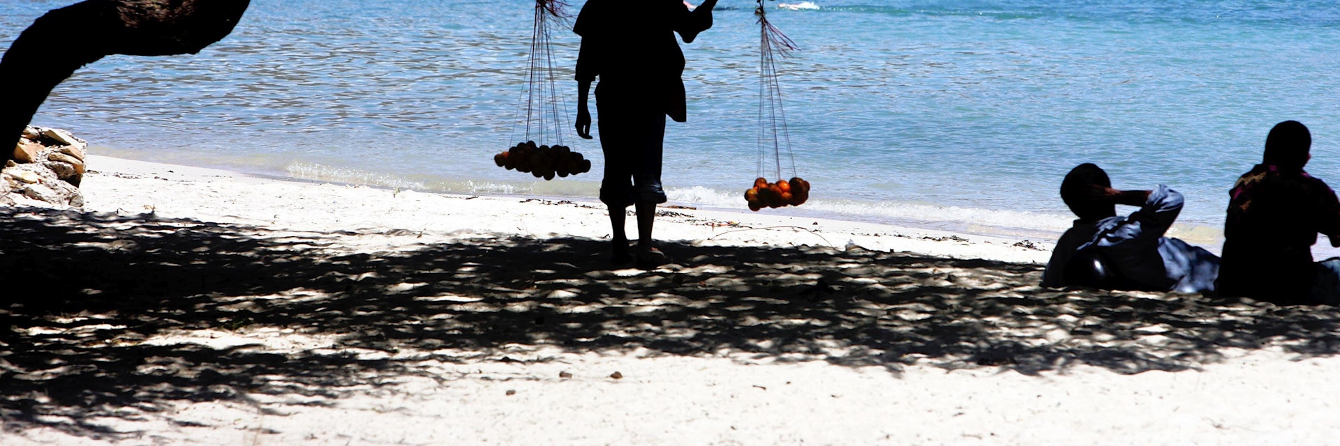 Timor, orange vendor on a beach in Dili