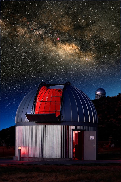 Two observatories at the McDonald Observatory in Ft. Davis, Texas with the summer Milky Way behind them. The Hobby Eberly (spectroscopy) telescope is on the hill in the back.