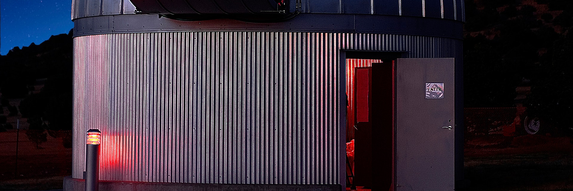 Two observatories at the McDonald Observatory in Ft. Davis, Texas with the summer Milky Way behind them. The Hobby Eberly (spectroscopy) telescope is on the hill in the back.