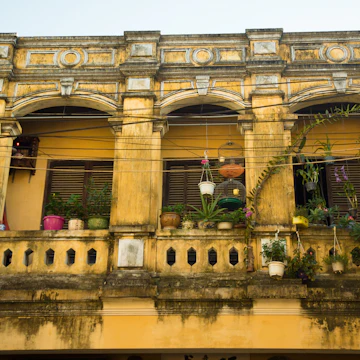 Traditional yellow ochre building in Hoi An, Vietnam; Shutterstock ID 352944071; Your name (First / Last): Josh Vogel; GL account no.: 56530; Netsuite department name: Online Design; Full Product or Project name including edition: Digital Content/Sights