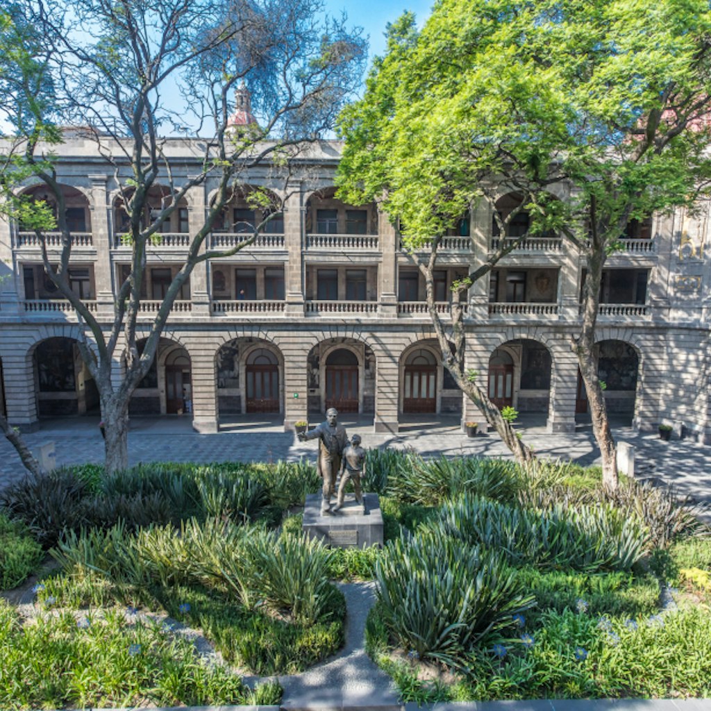 CDMX Mexico City 2018 MAY. Old Custom Ex Antigua Aduana, Antiguo colegio de San Ildefonso, Segreteria Educacion Publica building with internal courts, trees, series of arches paintings by Diego Rivera; Shutterstock ID 1122897197; Your name (First / Last): Sarah Stocking; GL account no.: 65050; Netsuite department name: Online editoiral; Full Product or Project name including edition: Mexico City BIT