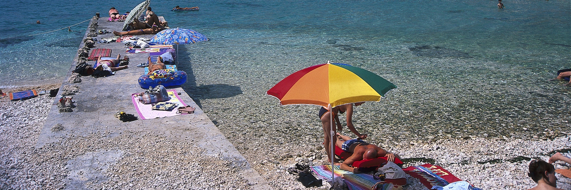 People on the beach in the sunlight, Baska, Krk, Croatia, Europe