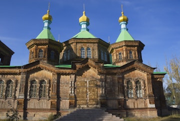 Wooden Holy Trinity Church with onion domes.