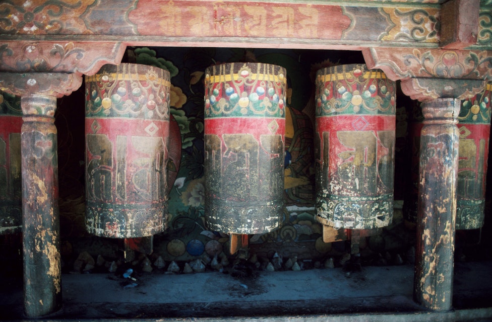 Weathered old prayer wheels at Sakya Monastery.