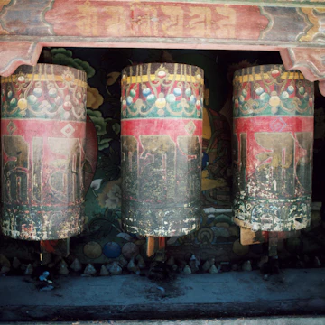 Weathered old prayer wheels at Sakya Monastery.
