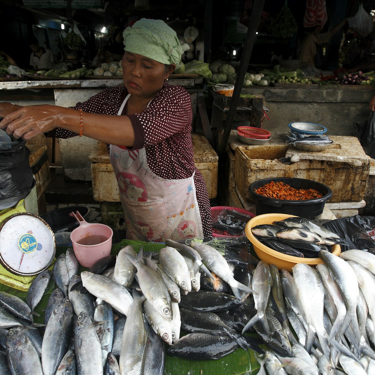 Vendor selling fish at Pasar Ikan fish market, Sunda Kelapa.