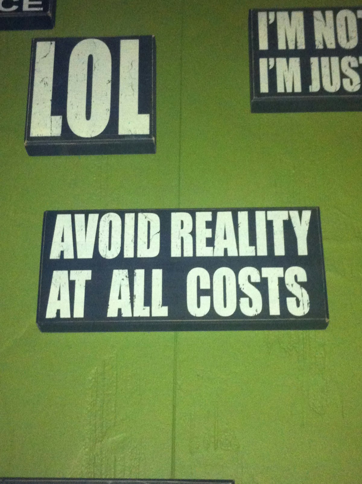 A few of the signs that adorn the walls of Bialystok Pub in Chicago.
