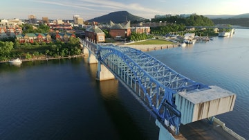 Aerial over Chattanooga Riverfront and Downtown at sunset; Shutterstock ID 476509726; Your name (First / Last): Trisha Ping; GL account no.: 65050; Netsuite department name: Online Editorial; Full Product or Project name including edition: 65050/Trisha Ping/Online Editorial/Chatty BiUS