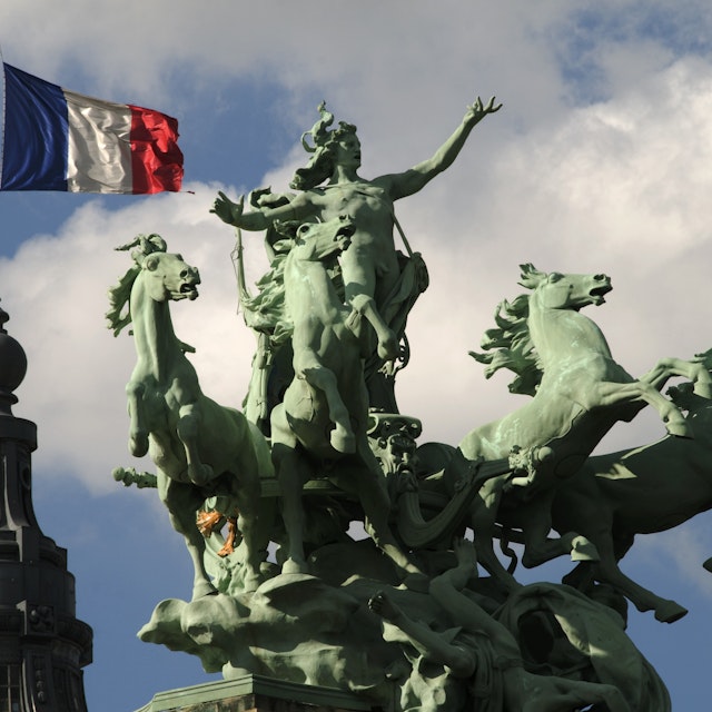 Spire and sculptures on roof of Grand Palais.