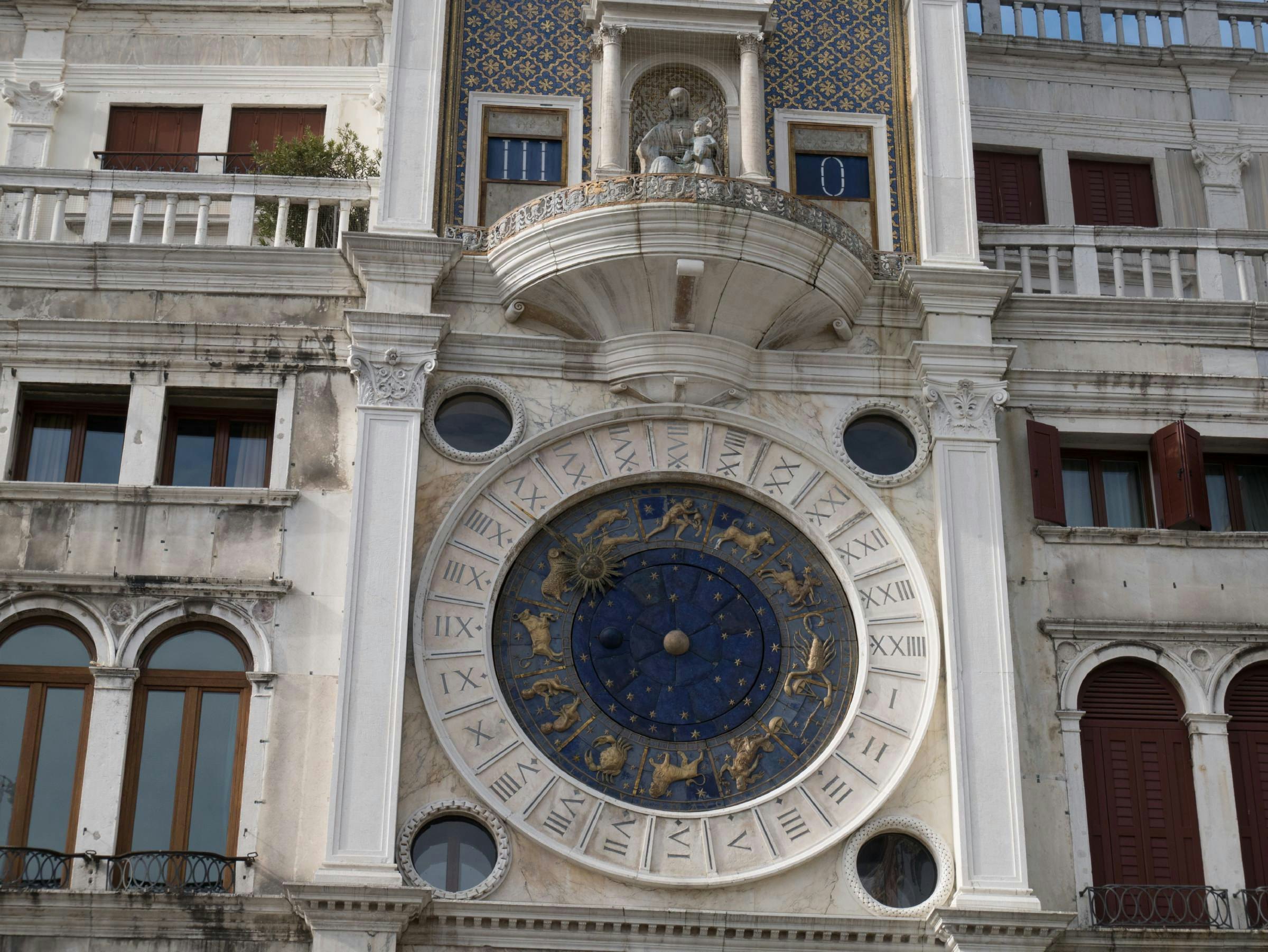 Torre dell'Orologio, the clock face shows both the hours and signs of the zodiac