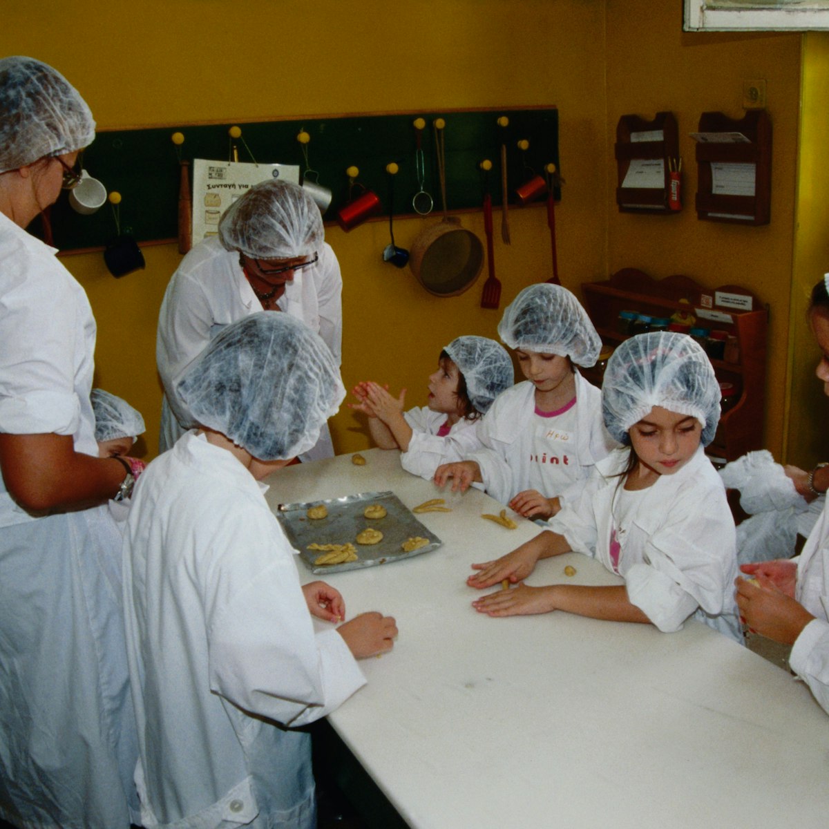Making cookies in the kitchen at the Children's Museum in Plaka.