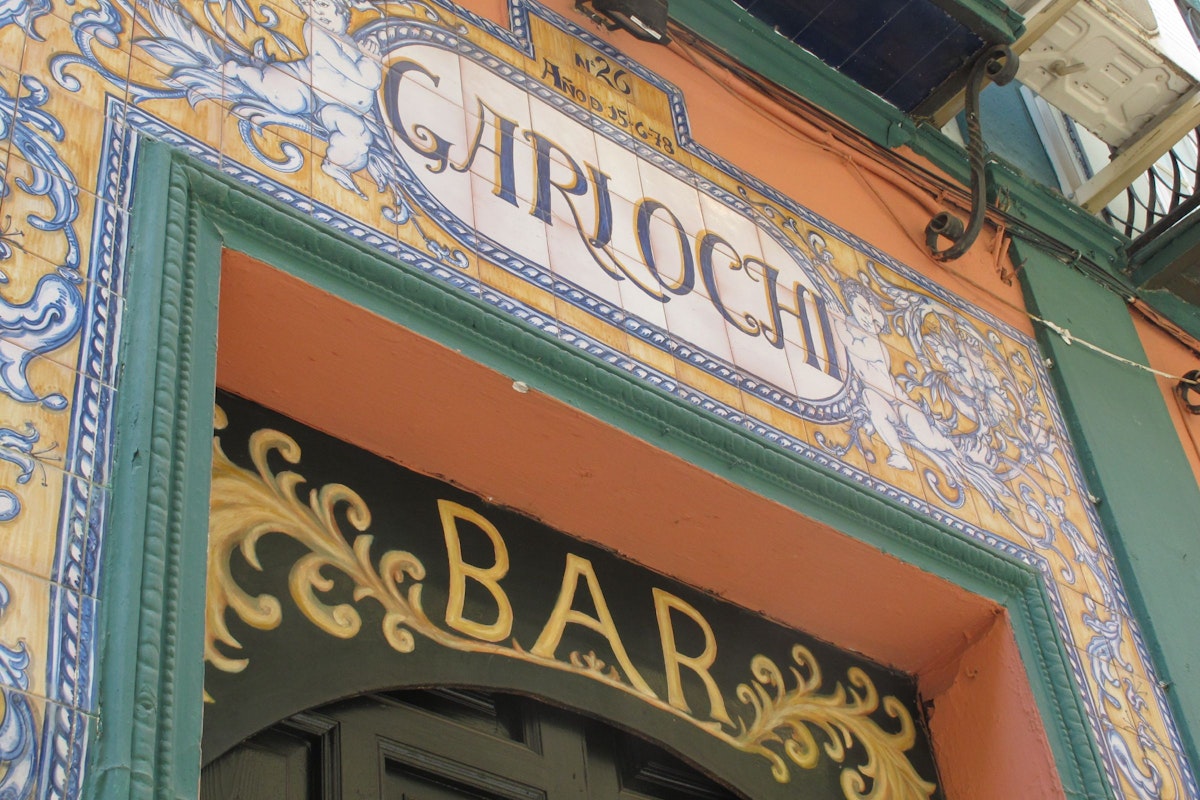 Garlochi bar sign over entrance in tiles.