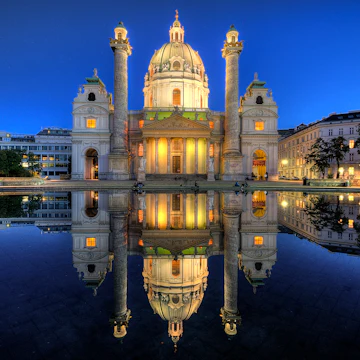 In 1713, one year after the last great plague epidemic, Charles VI, Holy Roman Emperor, pledged to build a church for his namesake patron saint, Charles Borromeo, who was revered as a healer for plague sufferers. .<a href="http://www.flickr.com/photos/worldtowalk/8108140070/in/set-72157631782023868/lightbox/"> To see my complete set of Austria, click here. </a>..Follow me on <a href="https://www.facebook.com/worldtowalk"> Facebook </a> and <a href="https://twitter.com/KAM0S"> Twitter</a>.