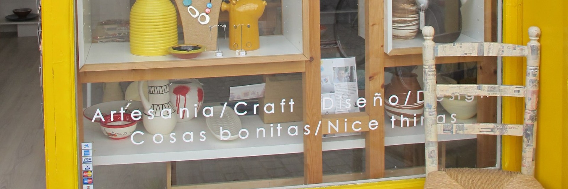 Janmei window display with chair.