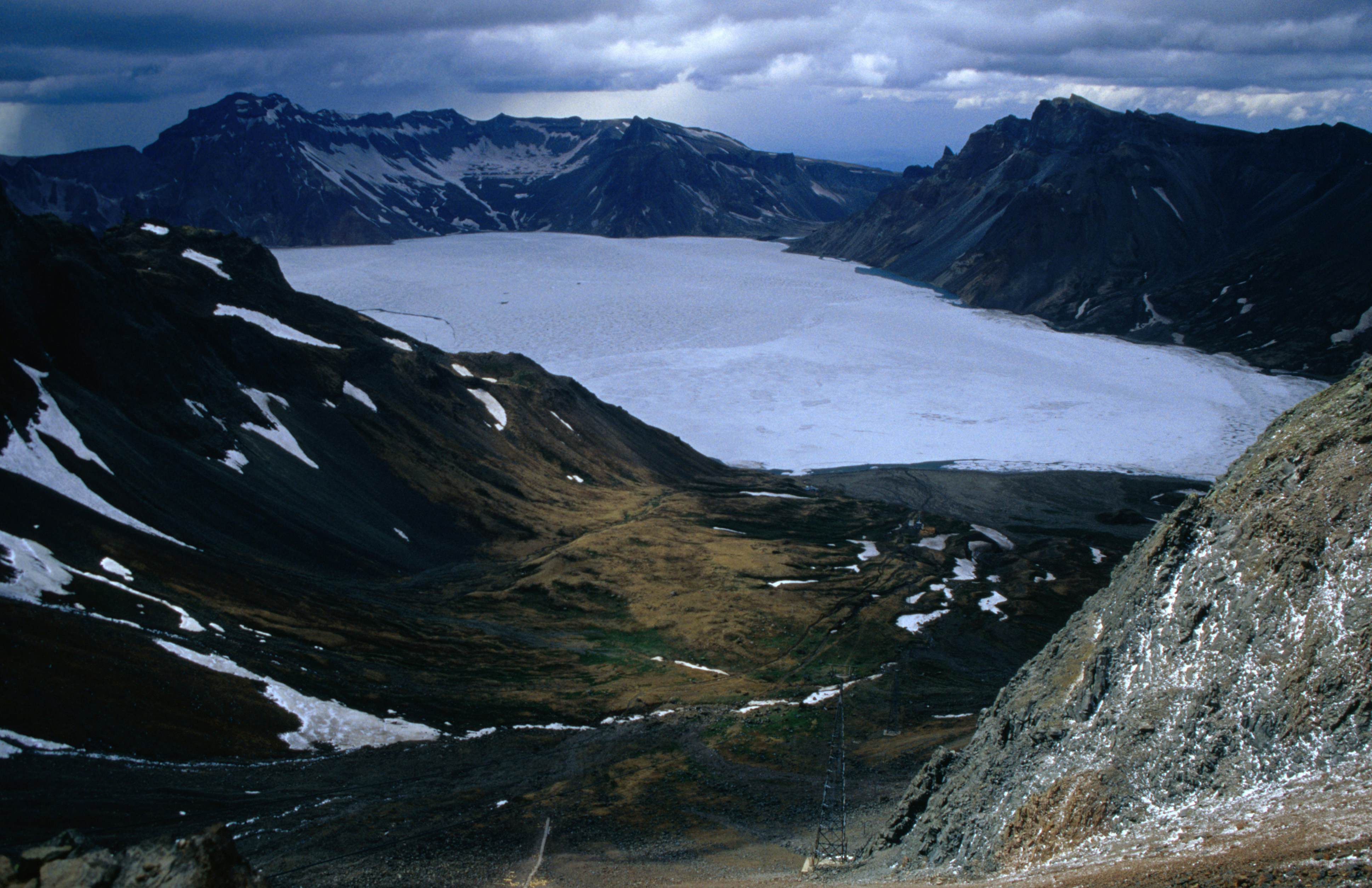 Frozen Lake Chon in late May from Mt Paekdu. The lake straddles the Chinese border.