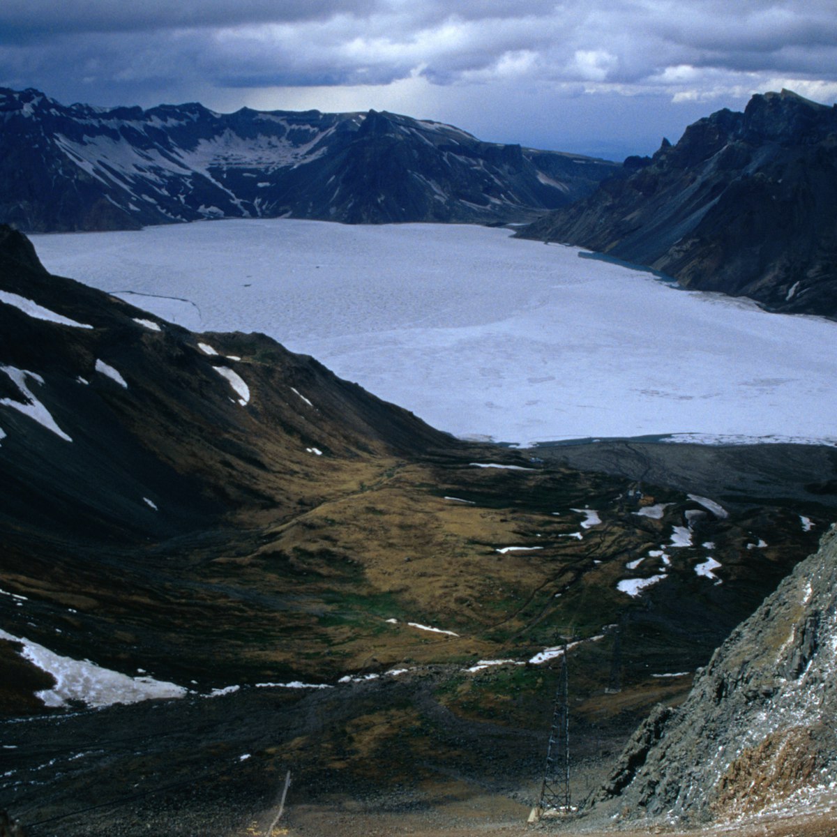 Frozen Lake Chon in late May from Mt Paekdu. The lake straddles the Chinese border.