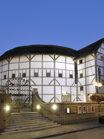 Dusk view of Shakespeare's Globe Theatre on the banks of the River Thames in London
