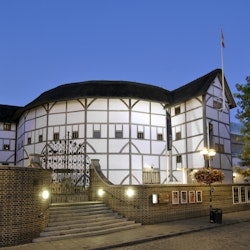Dusk view of Shakespeare's Globe Theatre on the banks of the River Thames in London