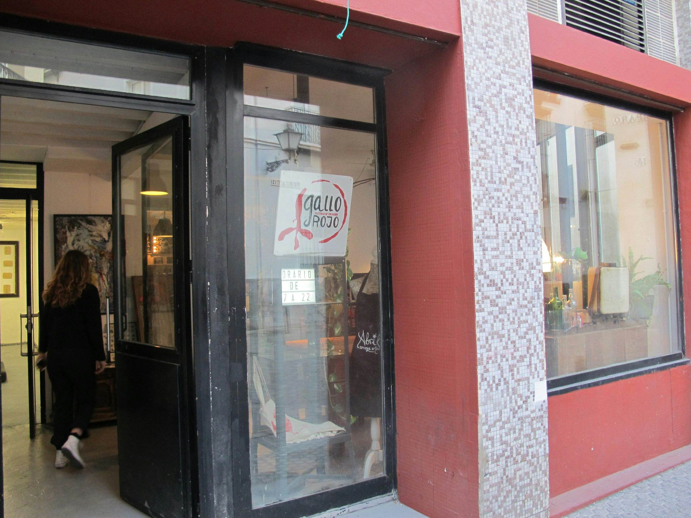 Exterior of Gallo Rojo bar - glass facade