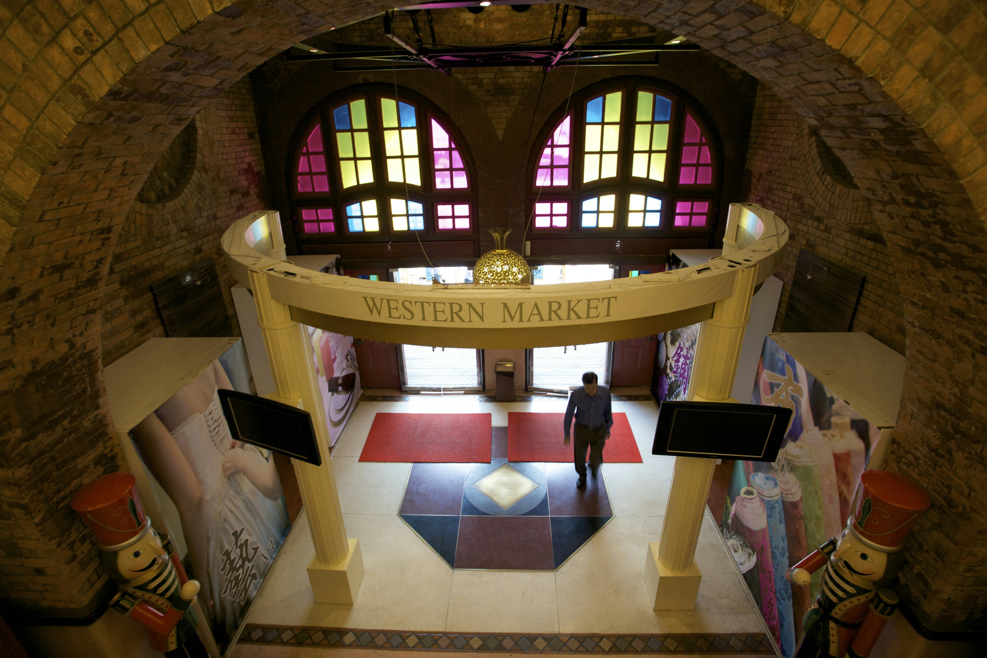 Man walking through entrance of Western Market in Sheung Wan.