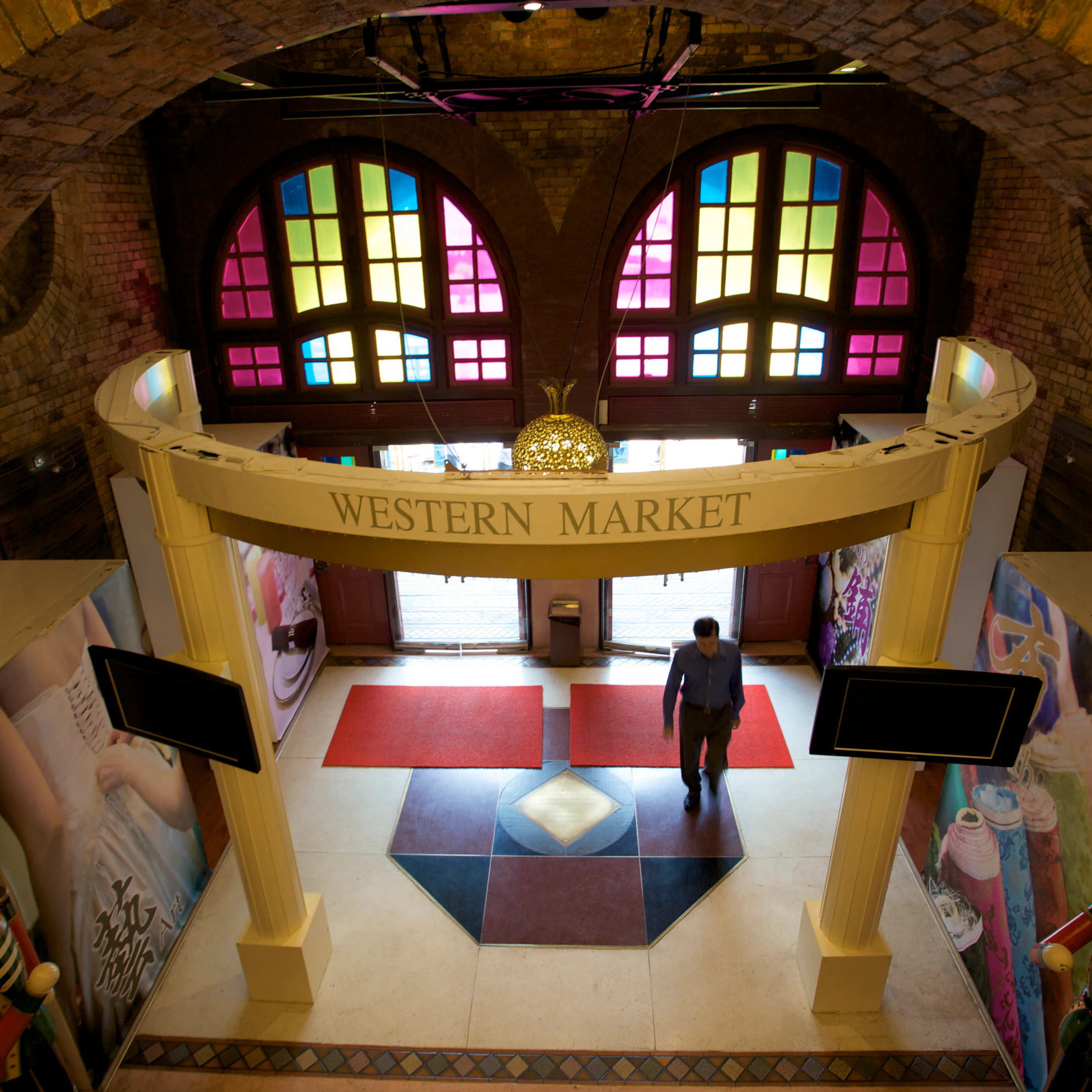 Man walking through entrance of Western Market in Sheung Wan.
