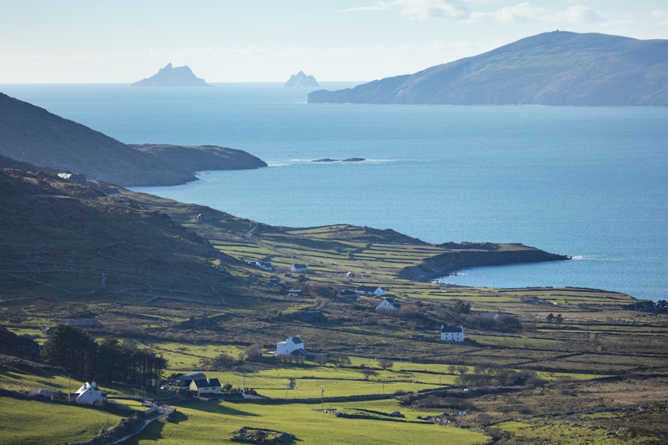 Coastal view over Ballinskelligs Bay to the Skellig Islands. County Kerry, Republic of Ireland.