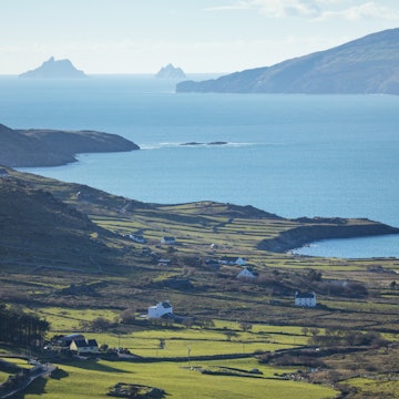 Coastal view over Ballinskelligs Bay to the Skellig Islands. County Kerry, Republic of Ireland.