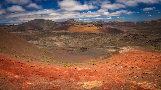 Panoramic view of the Timanfaya National Park ( also called The Montanas del Fuego or Mountains of Fire ) in Lanzarote, Canary Islands, Spain; Shutterstock ID 437700634; Your name (First / Last): Tom Stainer; GL account no.: 65050 ; Netsuite department name: Online Editorial; Full Product or Project name including edition: Best in Travel 2018
