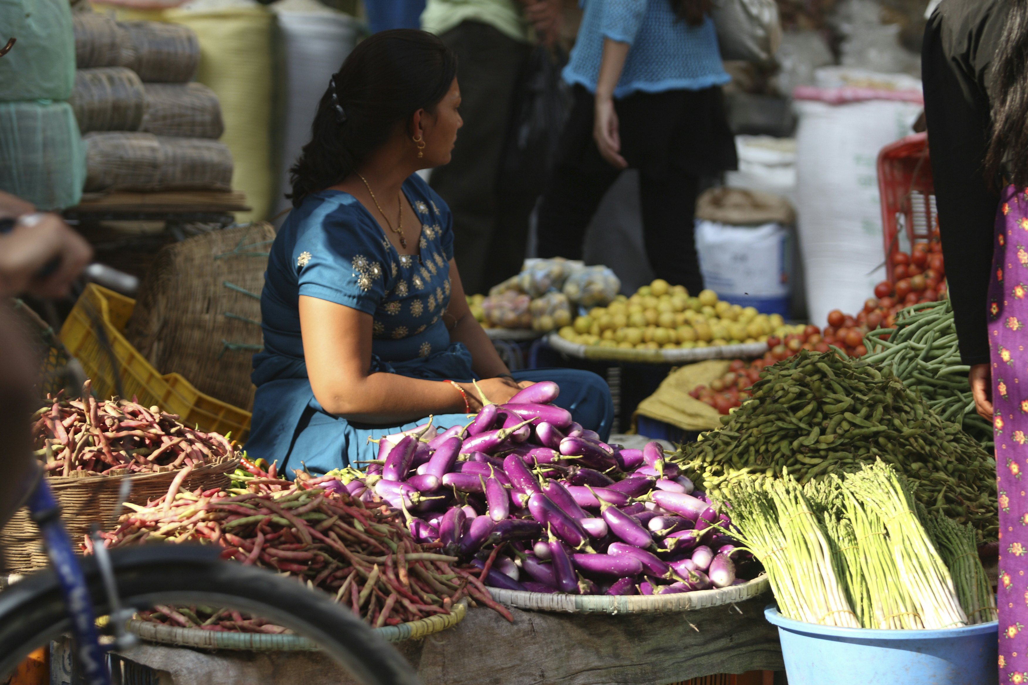 A vegetable seller, at Indra Chowk, Kathmandu. Tourism, accounted for 3.8 percent of the GDP in 1995-96, although numbers have fluctuated depending on the political situation in the country. The city's rich history is nearly 2000 years old, with Hinduism being the dominant religion followed by Buddhism. It is known as the land of the ethnic Newar community. (Newar means citizen of Nepal). Kathmandu, Nepal. 2010. (Photo by: Mahmud /Majority World/UIG via Getty Images)