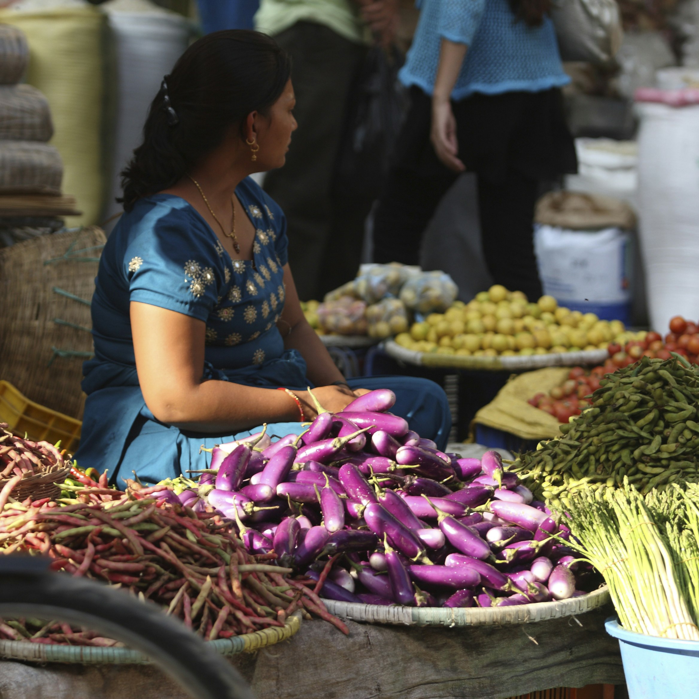 A vegetable seller, at Indra Chowk, Kathmandu. Tourism, accounted for 3.8 percent of the GDP in 1995-96, although numbers have fluctuated depending on the political situation in the country. The city's rich history is nearly 2000 years old, with Hinduism being the dominant religion followed by Buddhism. It is known as the land of the ethnic Newar community. (Newar means citizen of Nepal). Kathmandu, Nepal. 2010. (Photo by: Mahmud /Majority World/UIG via Getty Images)